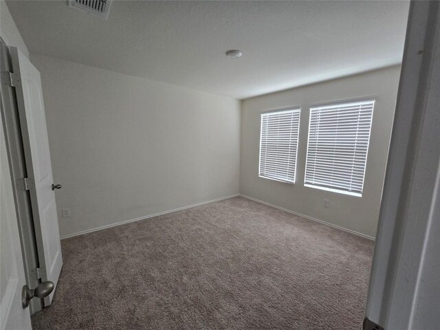12324 Token Trl, Elgin, TX 78621 - spare room with carpet and baseboards