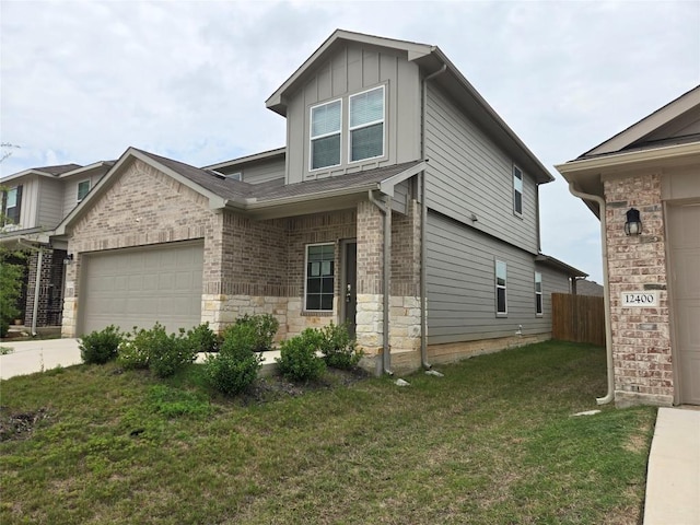 12324 Token Trl, Elgin, TX 78621 - view of front of house featuring an attached garage, stone siding, board and batten siding, and concrete driveway