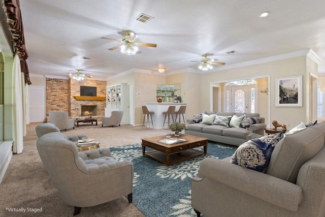 1204 Fairway Cir, Salado, TX 76571 - living room featuring ceiling fan, carpet floors, crown molding, and a fireplace