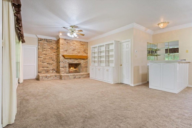 1204 Fairway Cir, Salado, TX 76571 - unfurnished living room with ceiling fan, carpet flooring, a fireplace, ornamental molding, and brick wall