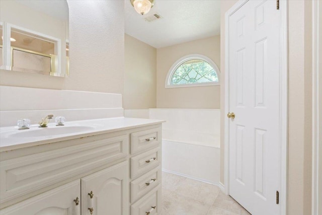 1204 Fairway Cir, Salado, TX 76571 - bathroom featuring vanity, tile patterned floors, and a shower with shower door