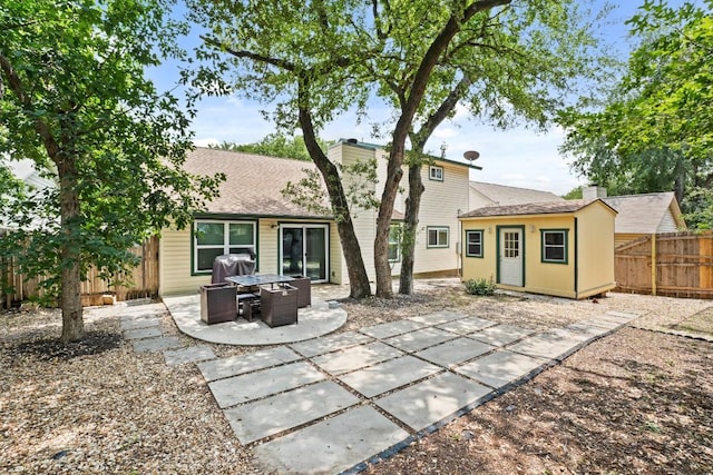12508 Terra Nova Ln, Austin, TX 78727 - rear view of house featuring a patio, a chimney, a fenced backyard, and roof with shingles