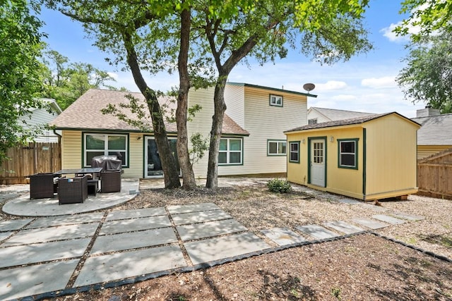 12508 Terra Nova Ln, Austin, TX 78727 - back of house with a patio, a shingled roof, and an outbuilding