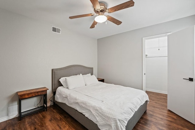 12508 Terra Nova Ln, Austin, TX 78727 - bedroom featuring wood finished floors, a ceiling fan, baseboards, and a spacious closet
