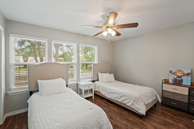 12508 Terra Nova Ln, Austin, TX 78727 - bedroom with dark wood finished floors, ceiling fan, and baseboards