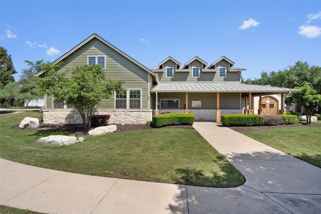 306 Water Oak Dr, Cedar Park, TX 78613 - view of front of home with a porch, a front yard, stone siding, metal roof, and a standing seam roof