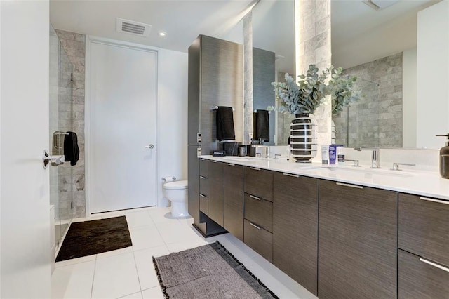301 W Ave Unit 4103, Austin, TX 78701 - full bath with double vanity, tile patterned floors, toilet, and a tile shower