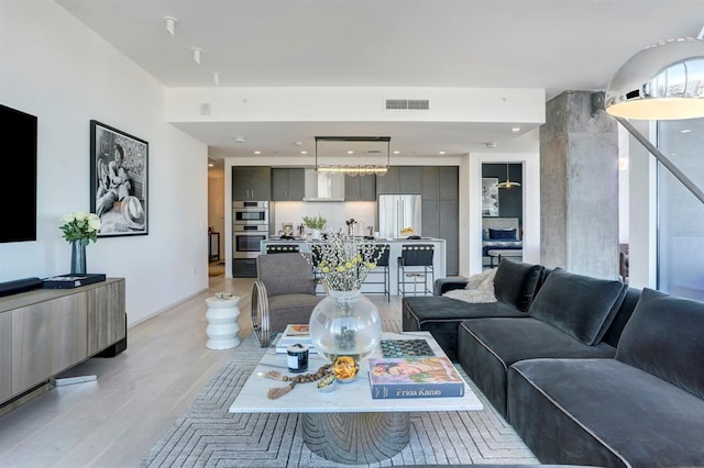 301 W Ave Unit 4103, Austin, TX 78701 - living room featuring light wood finished floors