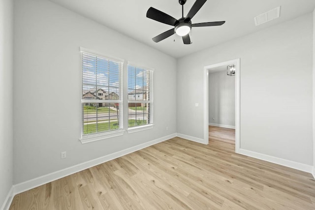 17109 Howdy Way, Manor, TX 78653 - spare room with baseboards, light wood-style floors, and a ceiling fan