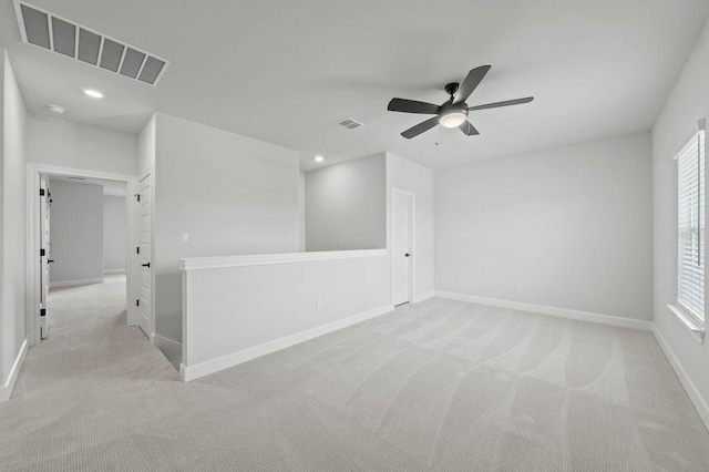17109 Howdy Way, Manor, TX 78653 - spare room with light carpet, a ceiling fan, baseboards, and recessed lighting