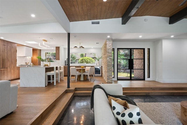 3403 Cascadera Dr, Austin, TX 78731 - living room featuring beamed ceiling and recessed lighting
