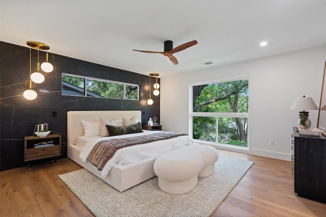 3403 Cascadera Dr, Austin, TX 78731 - bedroom with wood finished floors, a ceiling fan, and recessed lighting