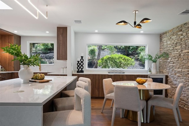 3403 Cascadera Dr, Austin, TX 78731 - dining room featuring wood finished floors, recessed lighting, and a chandelier