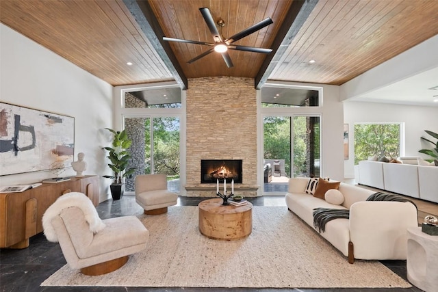 3403 Cascadera Dr, Austin, TX 78731 - living room with a wood ceiling with exposed beams, ceiling fan, healthy amount of natural light, a stone fireplace, and a high ceiling