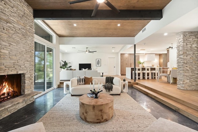 3403 Cascadera Dr, Austin, TX 78731 - living room with ceiling fan, a stone fireplace, a wood ceiling with exposed beams, recessed lighting, and marble finish floors