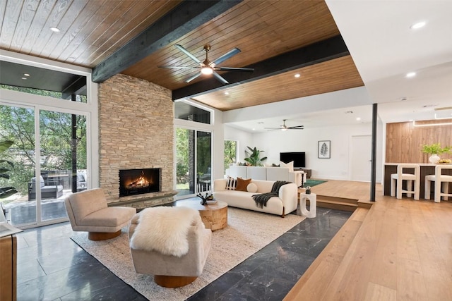 3403 Cascadera Dr, Austin, TX 78731 - living area featuring ceiling fan, a wooden ceiling with exposed beams, a fireplace, recessed lighting, and a high ceiling