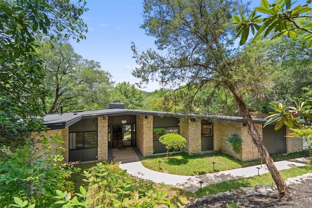 3403 Cascadera Dr, Austin, TX 78731 - view of front of home with a chimney