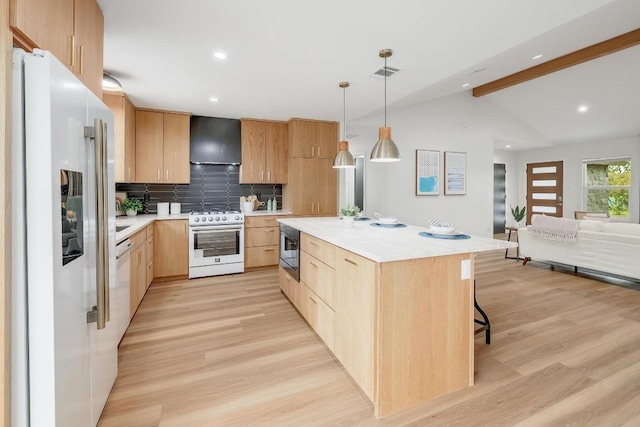 3812 Tarragona Ln, Austin, TX 78727 - kitchen with gas stove, refrigerator with ice dispenser, exhaust hood, light brown cabinets, and recessed lighting