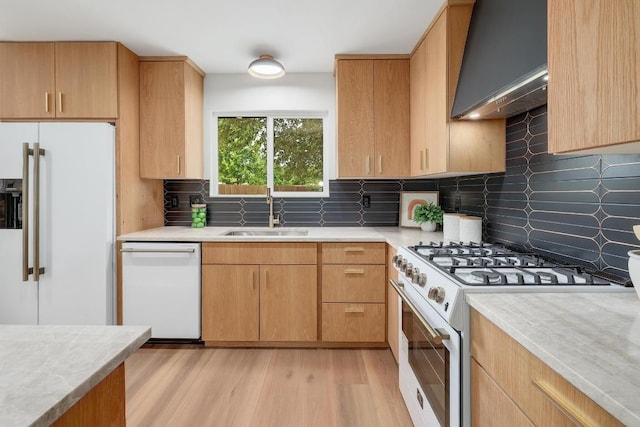 3812 Tarragona Ln, Austin, TX 78727 - kitchen featuring white appliances, a sink, custom range hood, light countertops, and light wood-style flooring