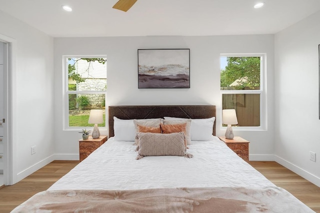 3812 Tarragona Ln, Austin, TX 78727 - bedroom with multiple windows, recessed lighting, light wood-style floors, and baseboards