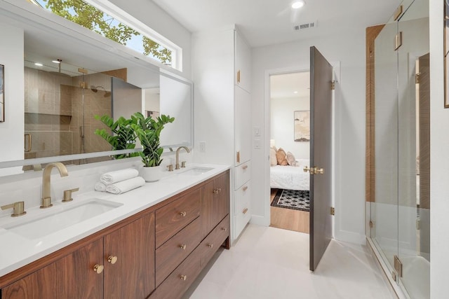 3812 Tarragona Ln, Austin, TX 78727 - ensuite bathroom featuring a shower stall, double vanity, and recessed lighting