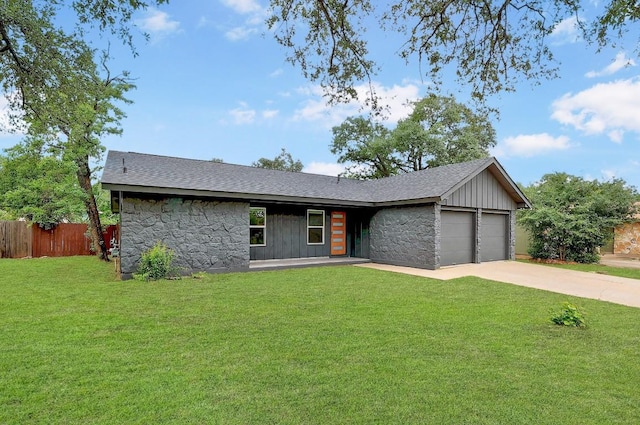 3812 Tarragona Ln, Austin, TX 78727 - mid-century modern home with stone siding, an attached garage, driveway, a shingled roof, and board and batten siding