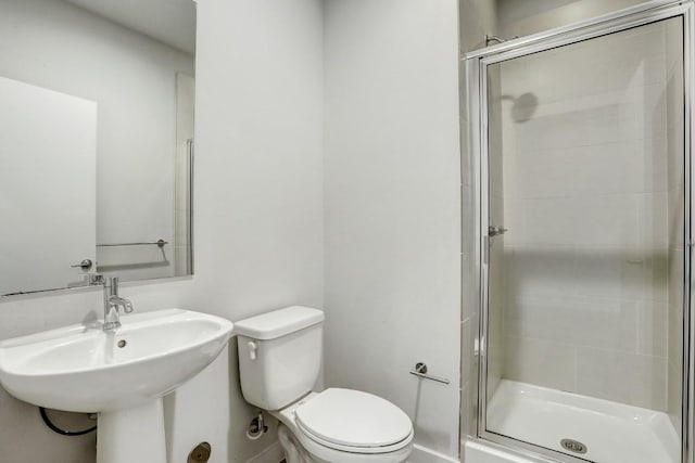 301 W Stassney Ln Unit 7, Austin, TX 78745 - full bath with toilet, a shower stall, a sink, and baseboards