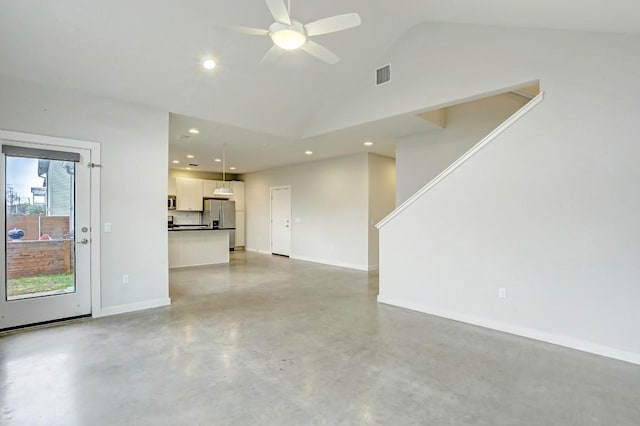 301 W Stassney Ln Unit 7, Austin, TX 78745 - unfurnished living room featuring finished concrete floors, a ceiling fan, vaulted ceiling, baseboards, and recessed lighting