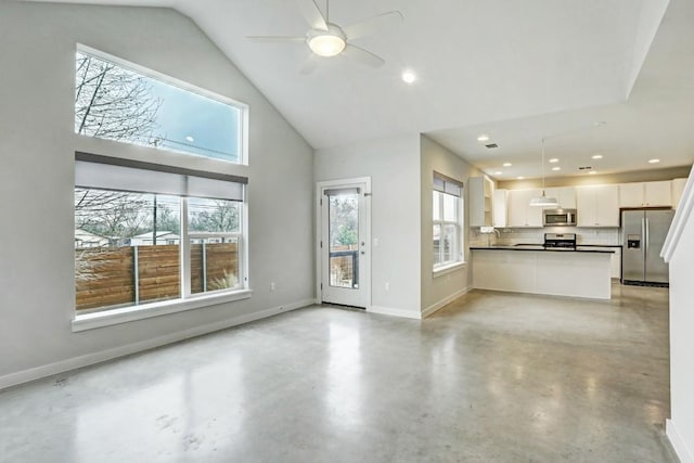 301 W Stassney Ln Unit 7, Austin, TX 78745 - unfurnished living room featuring baseboards, concrete flooring, a ceiling fan, recessed lighting, and a sink