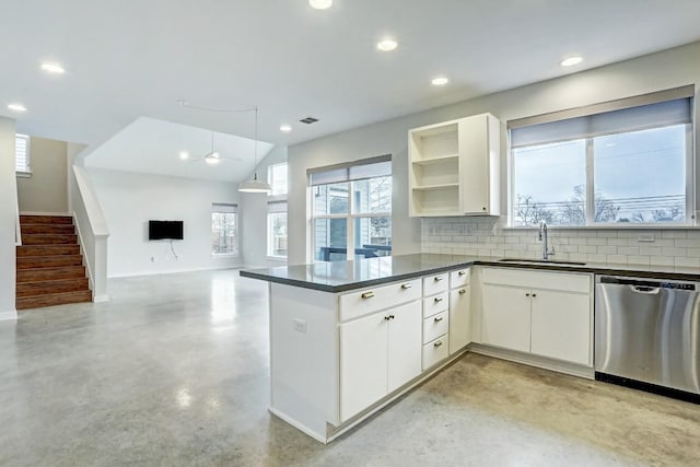 301 W Stassney Ln Unit 7, Austin, TX 78745 - kitchen with stainless steel dishwasher, a sink, dark countertops, concrete floors, and baseboards