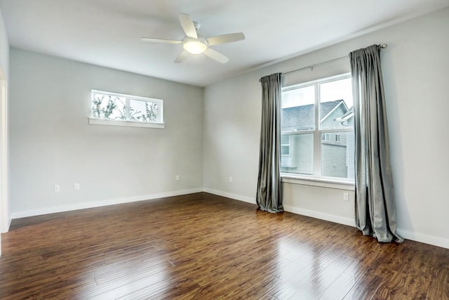 301 W Stassney Ln Unit 7, Austin, TX 78745 - unfurnished room featuring healthy amount of natural light, dark wood-style floors, ceiling fan, and baseboards
