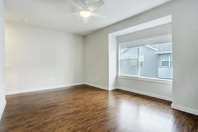 301 W Stassney Ln Unit 7, Austin, TX 78745 - empty room with dark wood finished floors, baseboards, and a ceiling fan