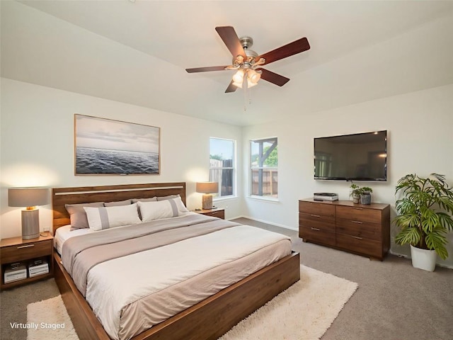 604 Creston St, Hutto, TX 78634 - bedroom with light carpet, ceiling fan, and baseboards