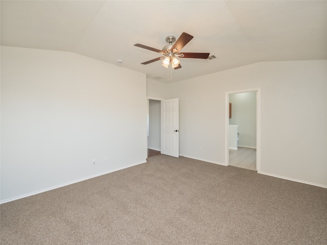 604 Creston St, Hutto, TX 78634 - unfurnished bedroom with lofted ceiling, carpet, baseboards, connected bathroom, and ceiling fan