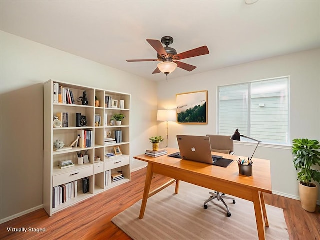 604 Creston St, Hutto, TX 78634 - office area with a ceiling fan, baseboards, and wood finished floors