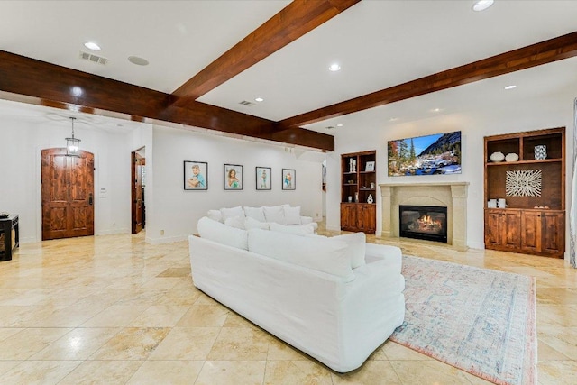 9308 Prince Charles, Austin, TX 78730 - living area featuring beamed ceiling, recessed lighting, built in shelves, a glass covered fireplace, and baseboards