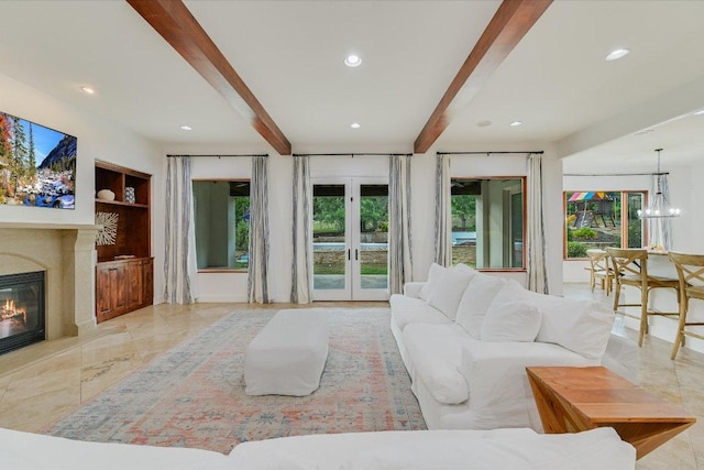 9308 Prince Charles, Austin, TX 78730 - living room with beam ceiling, french doors, recessed lighting, a glass covered fireplace, and built in features