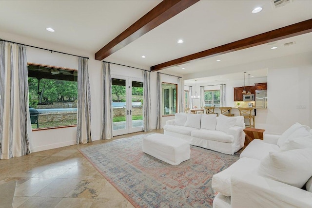 9308 Prince Charles, Austin, TX 78730 - living area featuring beamed ceiling, recessed lighting, and baseboards
