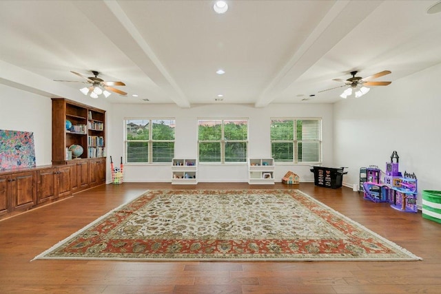 9308 Prince Charles, Austin, TX 78730 - living room featuring a ceiling fan, beamed ceiling, wood finished floors, and recessed lighting