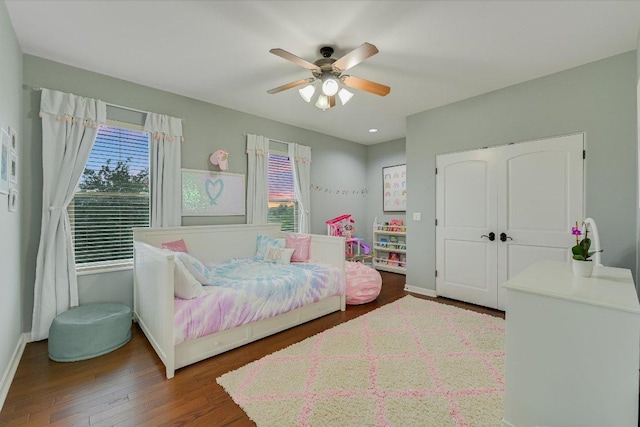 9308 Prince Charles, Austin, TX 78730 - bedroom featuring multiple windows, wood finished floors, ceiling fan, and baseboards