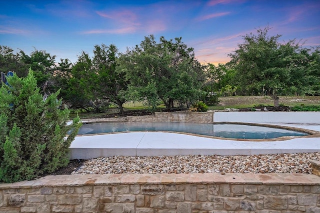 9308 Prince Charles, Austin, TX 78730 - pool at dusk with an outdoor pool