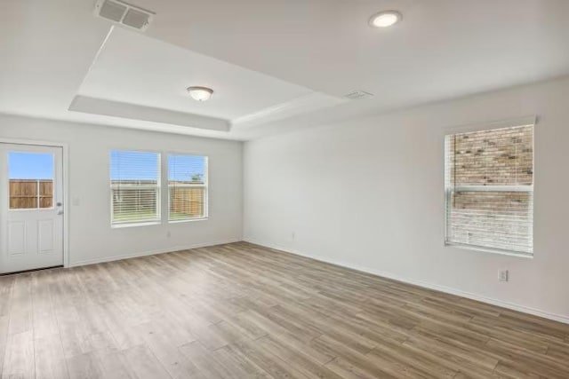 2807 Dimmit Dr, Temple, TX 76501 - unfurnished room featuring a raised ceiling, wood finished floors, and baseboards