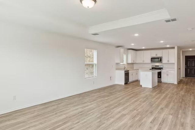2807 Dimmit Dr, Temple, TX 76501 - unfurnished living room featuring light wood-style flooring, a sink, recessed lighting, and baseboards