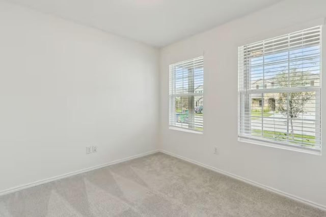 2807 Dimmit Dr, Temple, TX 76501 - spare room featuring light carpet and baseboards