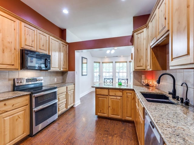 20104 Bunker Cv, Lago Vista, TX 78645 - kitchen with stainless steel appliances, recessed lighting, light stone countertops, dark wood-style flooring, and decorative backsplash