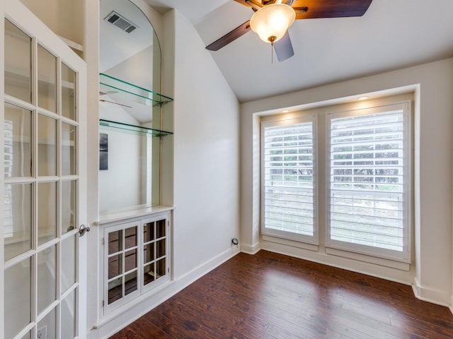 20104 Bunker Cv, Lago Vista, TX 78645 - empty room featuring vaulted ceiling, a ceiling fan, and wood finished floors