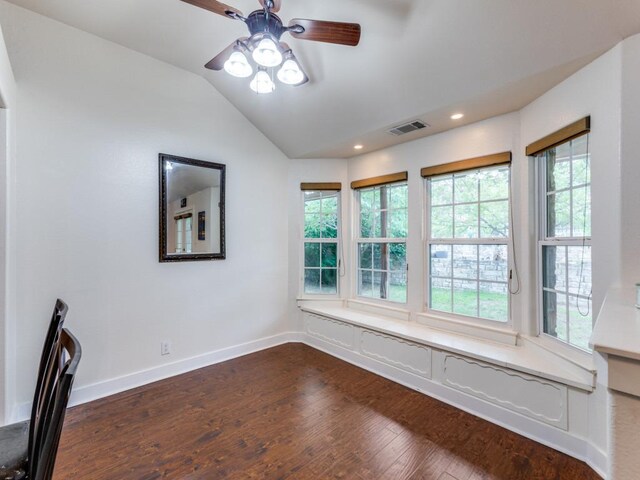 20104 Bunker Cv, Lago Vista, TX 78645 - unfurnished room featuring dark wood-style floors, vaulted ceiling, plenty of natural light, a ceiling fan, and recessed lighting