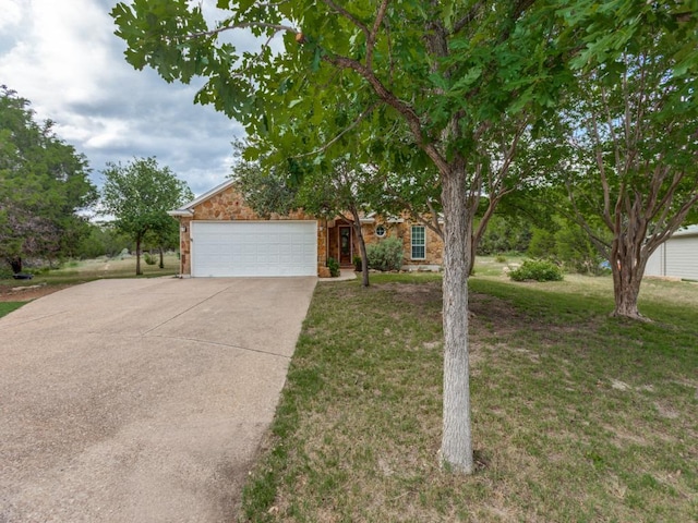 20104 Bunker Cv, Lago Vista, TX 78645 - obstructed view of property with driveway, a front yard, and a garage