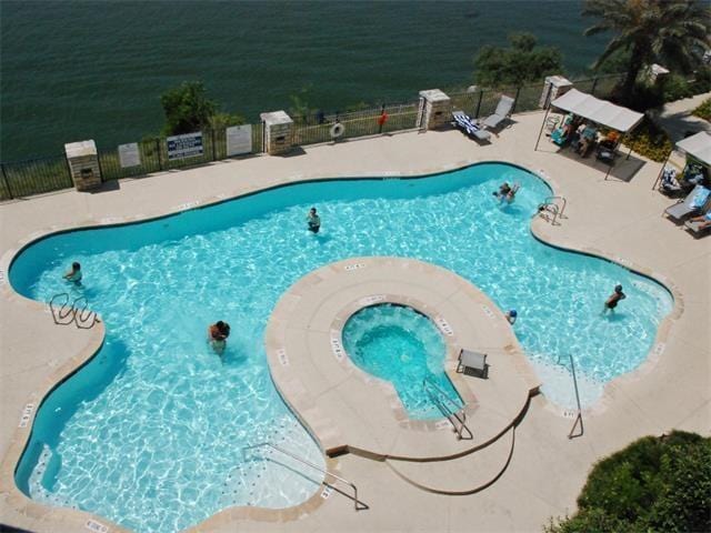 3404 American Dr Unit 2101, Lago Vista, TX 78645 - community pool with a patio and a community hot tub