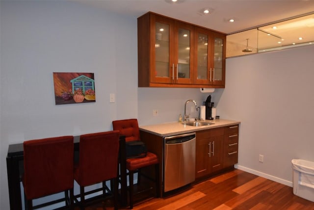 3404 American Dr Unit 2101, Lago Vista, TX 78645 - bar featuring dishwasher, a sink, dark wood-style flooring, recessed lighting, and baseboards